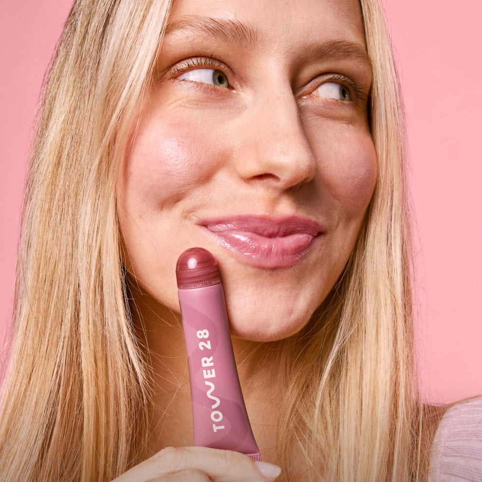 Tower 28 Beauty's LipSoftie® Lip Treatment in Sugar Plum applied on model